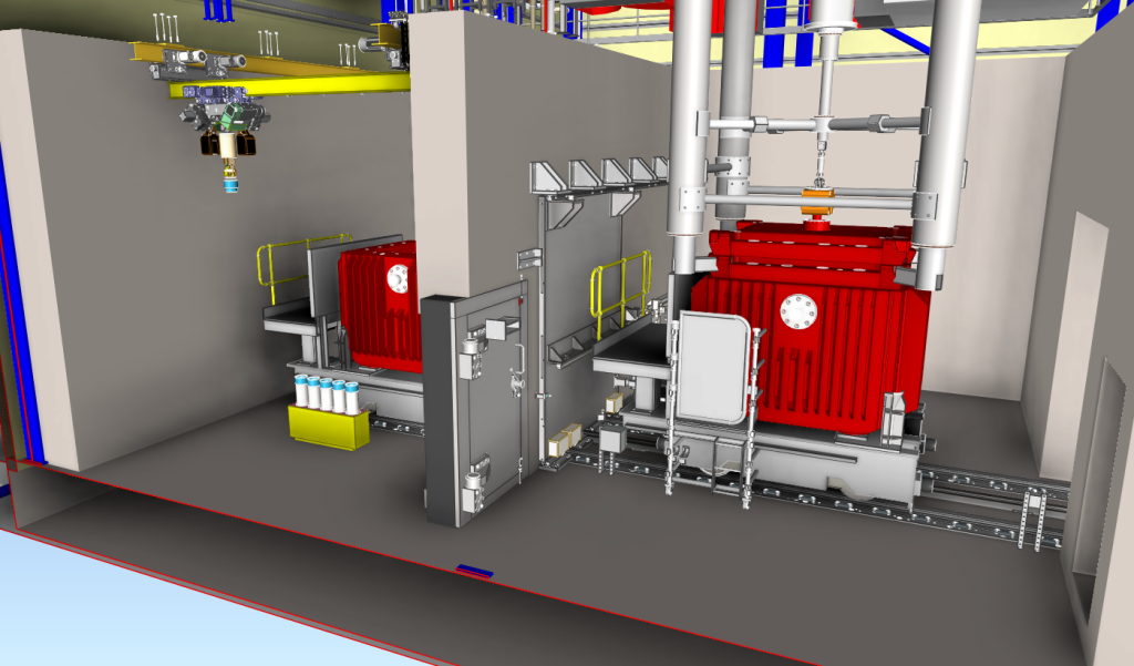 Industrial machinery setup with two large red equipment units inside a facility, surrounded by metal structures, rail tracks, and control panels.